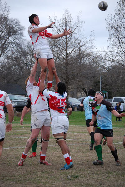 Chad Joseph is lifted by his teammates in a lineout