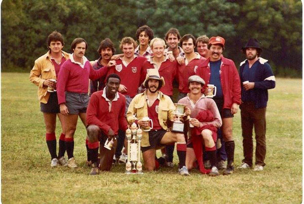 Dallas Rugby 1970s team posing after winning Championship